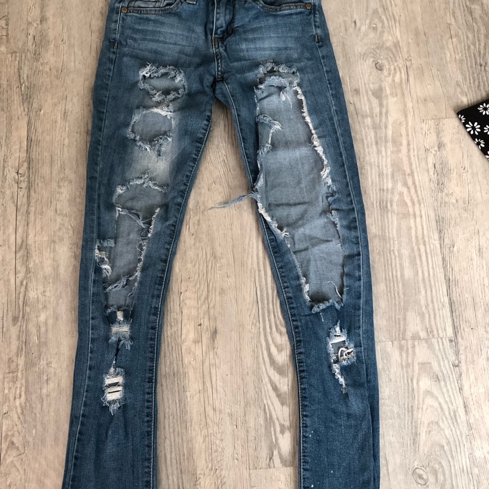 Distressed Mid- Rise Jeans